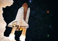 Spaceship takes off into the night sky on a mission.Elements of this image furnished by NASA