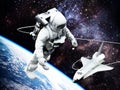 Spacewalking astronaut with a view of the Earth and space shuttle at the background. 3D illustration Royalty Free Stock Photo