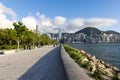 Spacial walking area in West Kowloon Waterfront, Hong Kong. Buildings in Hong Kong Island, Victoria harbour and blue sky in