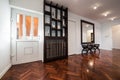 Spacious anteroom interior with large mirror and shiny brown par