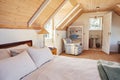 Spacious attic bedroom with bathroom in a home Royalty Free Stock Photo