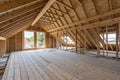 Spacious attic under construction with exposed wooden beams Royalty Free Stock Photo
