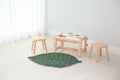 Spacious baby room with wooden furniture. Interior design