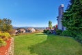 Spacious back yard with grass filled garden and amazing view. Royalty Free Stock Photo