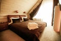 Spacious bedroom with beamed wooden ceiling