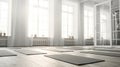 Spacious bright yoga studio studio with exercise mats
