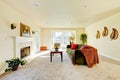 Spacious creamy tones interior of family room with green velvet sofa . Royalty Free Stock Photo