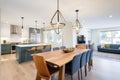 spacious dining area with an oversized, offcenter lighting fixture