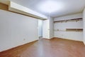 Spacious empty garage interior with two shelves on the wall. Royalty Free Stock Photo