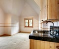 Spacious empty kitchen with cathedral ceiling