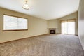 Spacious empty living room with fireplace