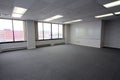 Spacious Empty Office Space with Urban View and Brainstorming Potential