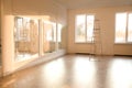 Spacious empty room with new parquet flooring and mirrors Royalty Free Stock Photo