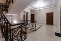 Spacious entrance hall with light walls and marble floor. Front entrance foyer entrance hall