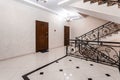 Spacious entrance hall with light walls and marble floor. Front entrance foyer entrance hall