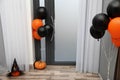 Spacious hallway with balloons and pumpkins for Halloween