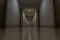 Spacious hallway with many doors leading into condominium rooms. Selective focus