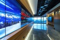 Spacious interior of a business building with very large monitors