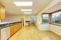 Spacious kitchen room with cabinets and black granite tops. Royalty Free Stock Photo