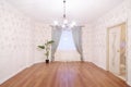 Spacious light room with chandelier and window Royalty Free Stock Photo