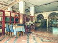 Spacious lounge with tables and chairs. dining room in the hotel for meals. ceramic tiles on the floor, large-format material