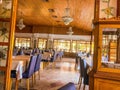 Spacious lounge with tables and chairs. dining room in the hotel for meals. tourists at lunch. expensive crystal chandeliers hang