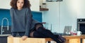 Young woman on island table, stylish kitchen love Royalty Free Stock Photo