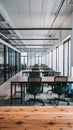 Spacious office with wooden desks, black mesh chairs, large windows, clean ambiance