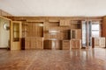 Spacious room with wooden mural covering one wall with parquet wood