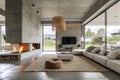 Spacious villa interior with cement wall effect, fireplace and tv. Royalty Free Stock Photo