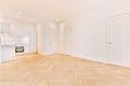 Spacious white room with kitchen area Royalty Free Stock Photo