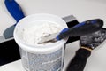 Spackling knive in plaster Royalty Free Stock Photo