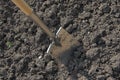 A spade digging the soil