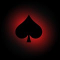 Spades symbol on dark background with red light