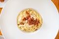 Spagehtti cabonara on plate with bacon close up Royalty Free Stock Photo