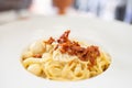 Spagehtti cabonara on plate with bacon close up Royalty Free Stock Photo