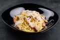 Spagetti carbonara on a black plate Royalty Free Stock Photo