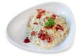 Spaghetti Bacon Carbonara in white plate on white isolated