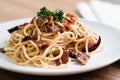 Spaghetti bacon chilli garlic in a round white dish Royalty Free Stock Photo