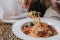 Spaghetti bacon, garlic, basil, dried chili pepper and cherry tomato on wood background. Royalty Free Stock Photo