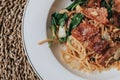 Spaghetti bacon, garlic, basil, dried chili pepper and cherry tomato on wood background. Royalty Free Stock Photo