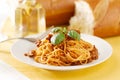 Spaghetti with basil garnish in meat sauce