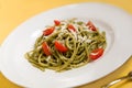 Spaghetti with basil pesto and tomatoes Royalty Free Stock Photo