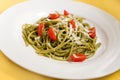 Spaghetti with basil pesto and tomatoes Royalty Free Stock Photo