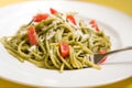 Spaghetti with basil pesto and tomatoes Royalty Free Stock Photo