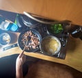 Spaghetti being boiled in boiling water along with walnut, ham and garlic being fried in a saucepan close-up top view. Italian Royalty Free Stock Photo