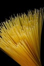 Spaghetti on a black background, popular food. Spaghetti is a kind of pasta made of dried wheat dough, thin with a round section.