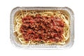 Spaghetti bolognese in aluminium foil box isolated on white background. Selective focus. Concept for take away and delivery food. Royalty Free Stock Photo