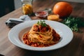 Spaghetti bolognese beautifully presented on the kitchen table