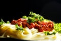 Spaghetti bolognese in black plate Royalty Free Stock Photo